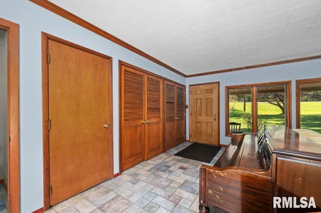 a view of a living room and a balcony