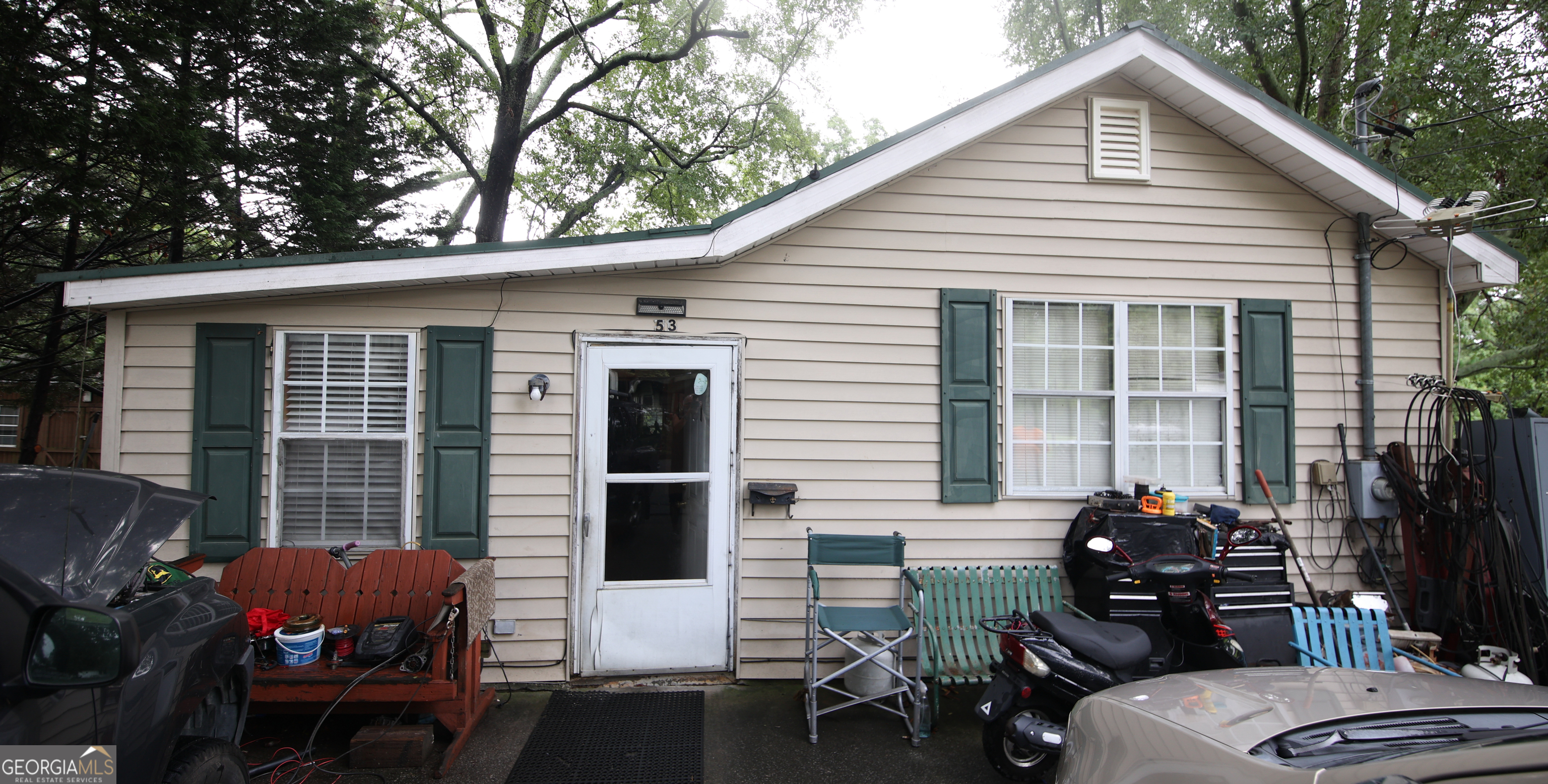 51 Busha Street Toccoa, GA 30577 - Photo 1 of 12 a backyard of a house with table and chairs