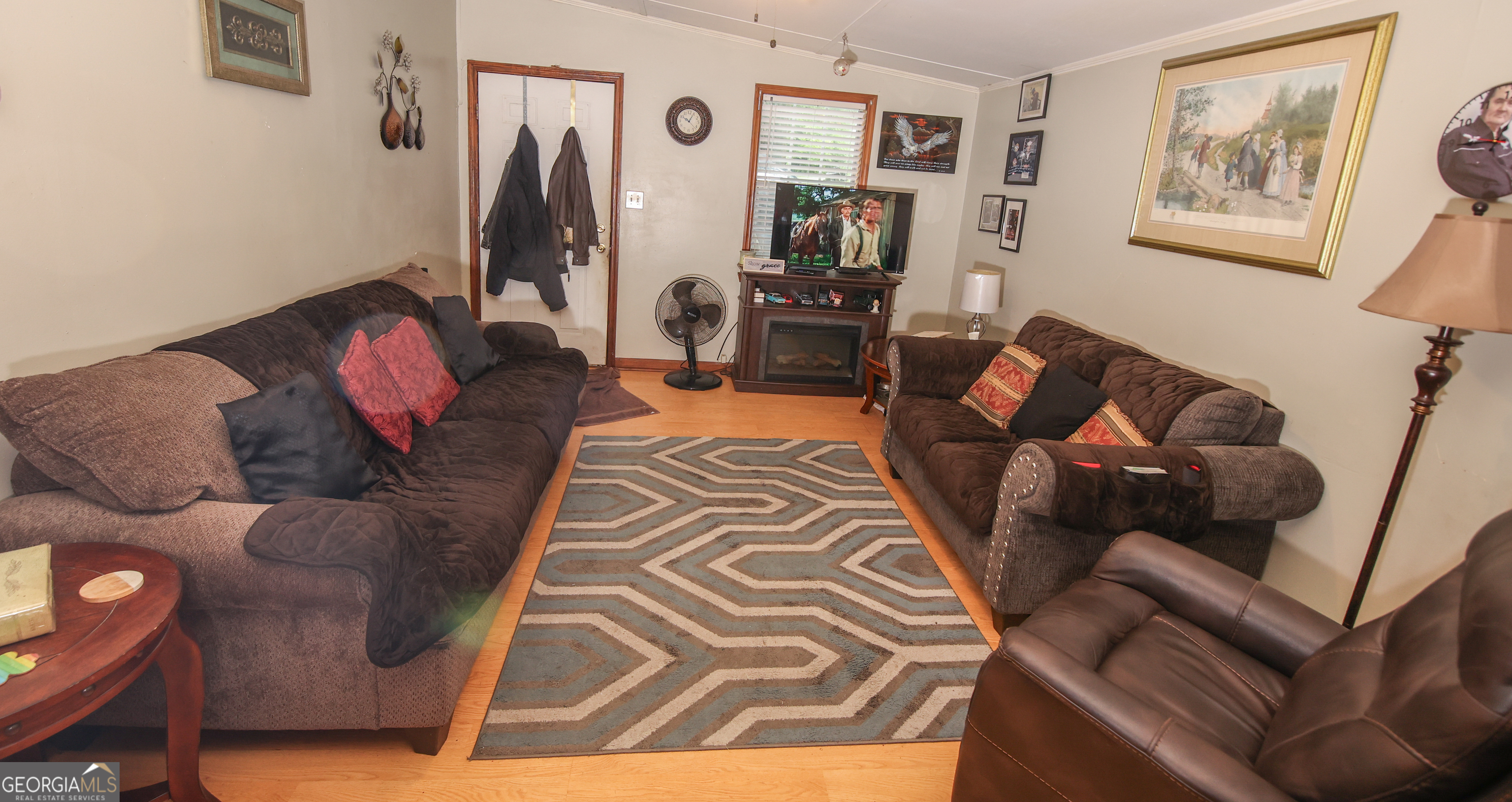 51 Busha Street Toccoa, GA 30577 - Photo 11 of 12 a living room with furniture and a flat screen tv