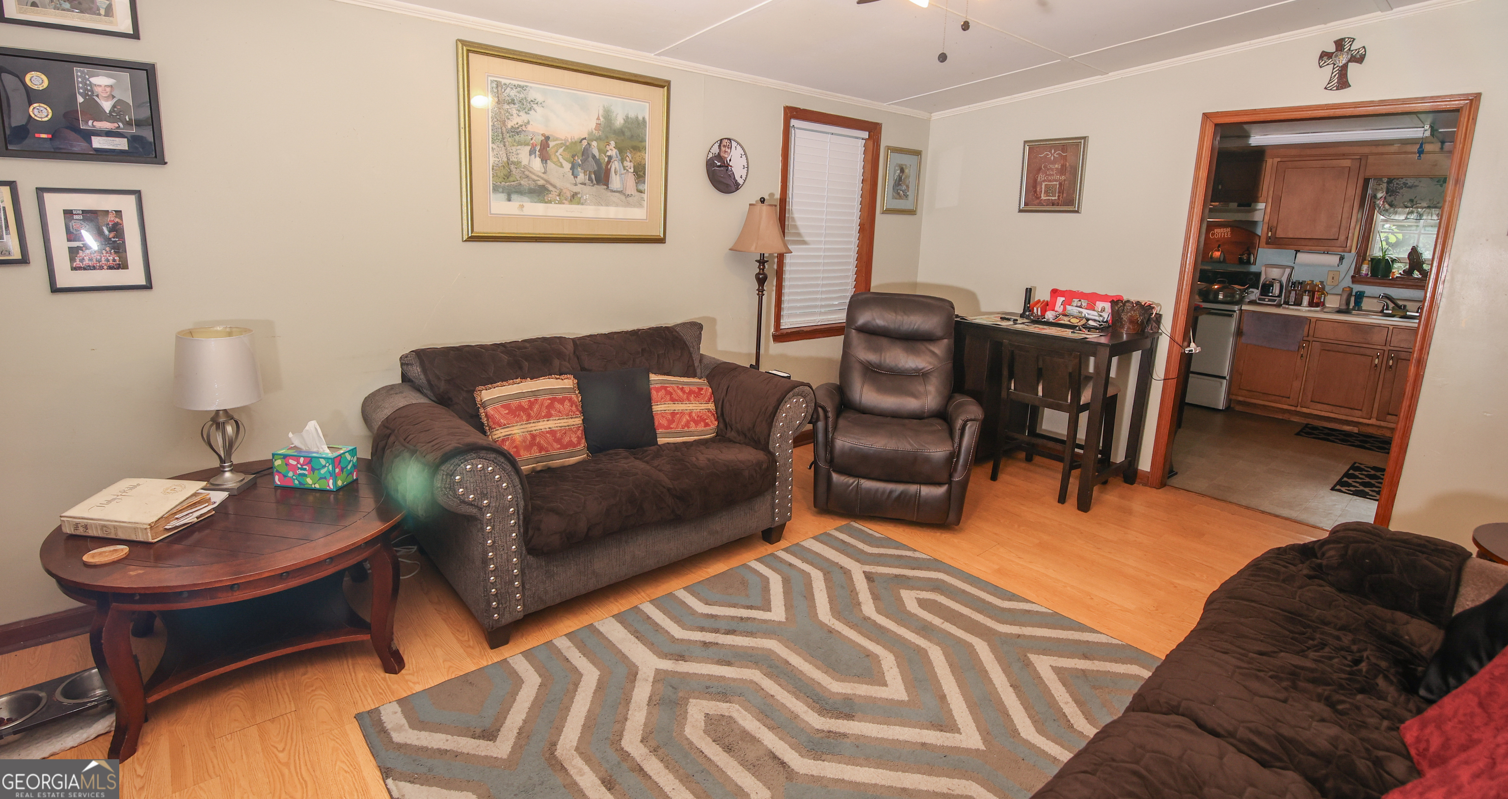 51 Busha Street Toccoa, GA 30577 - Photo 12 of 12 a living room with furniture and a dining table