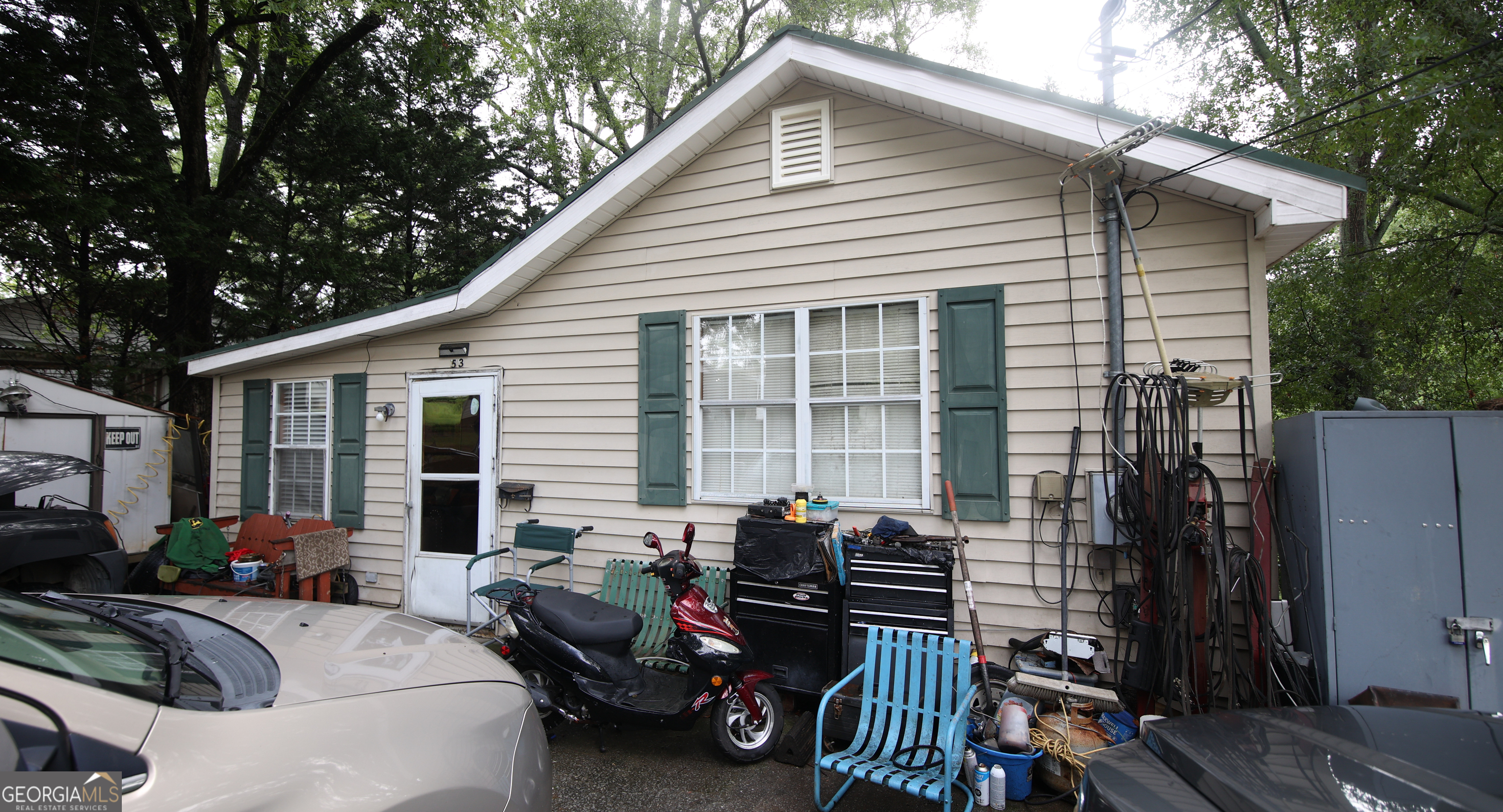 51 Busha Street Toccoa, GA 30577 - Photo 2 of 12 a view of a patio with couches and chairs under an umbrella