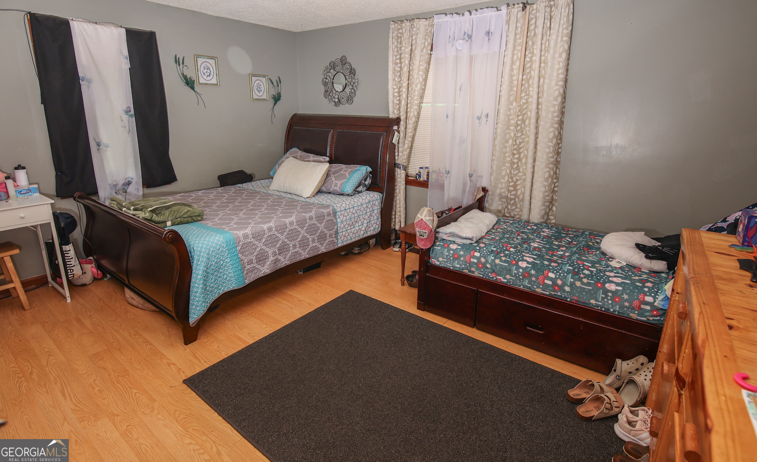 51 Busha Street Toccoa, GA 30577 - Photo 9 of 12 a bedroom with a bed and a night stand