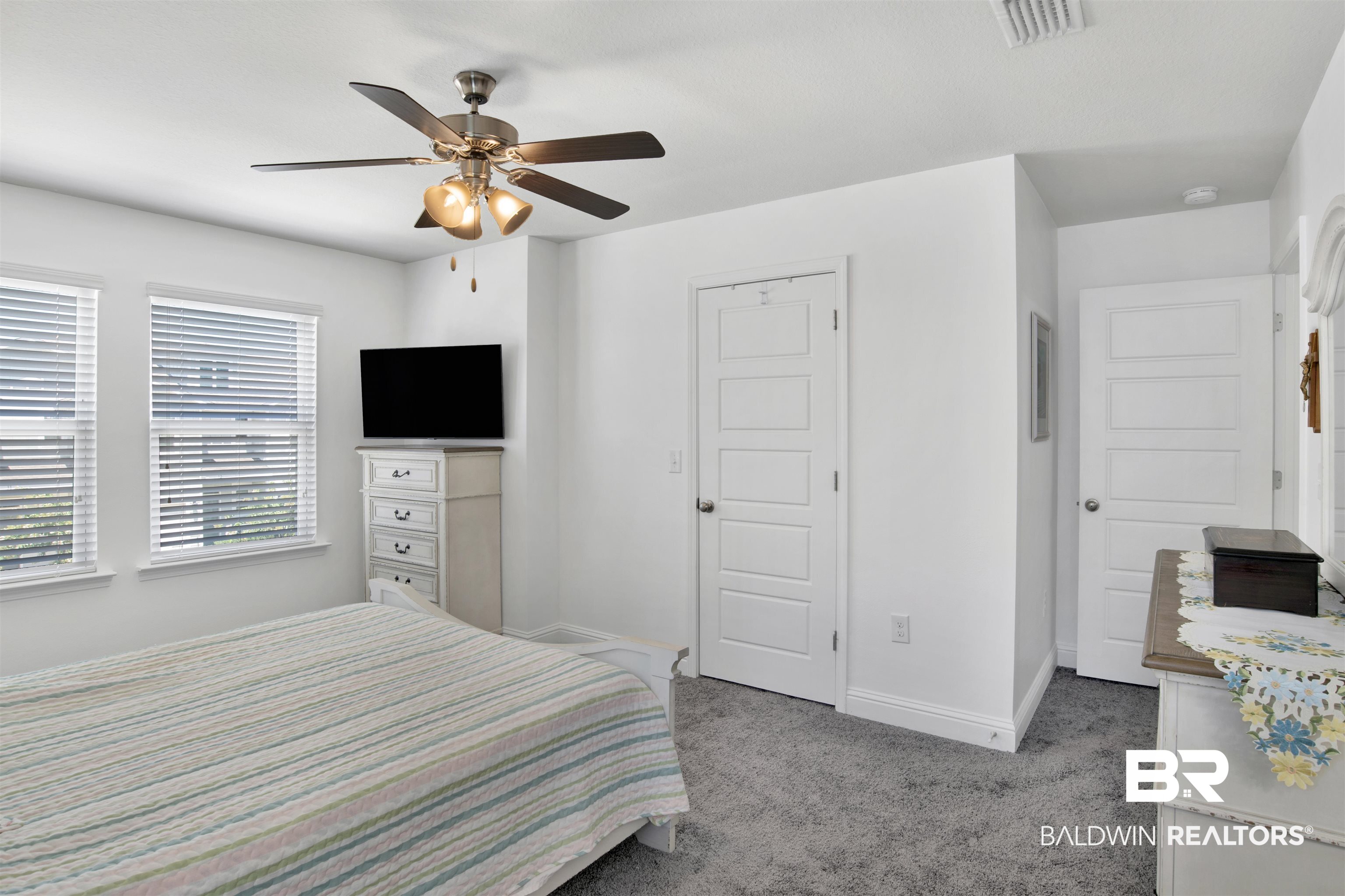 25806 Pollard Road, Unit 20 Daphne, AL 36526 - Photo 15 of 29 Carpeted bedroom with ceiling fan