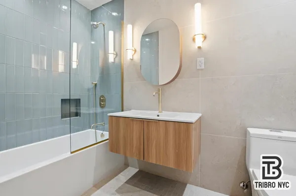 a bathroom with a sink a mirror and a bathtub