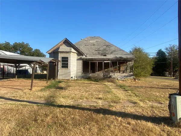 a house with trees in the background