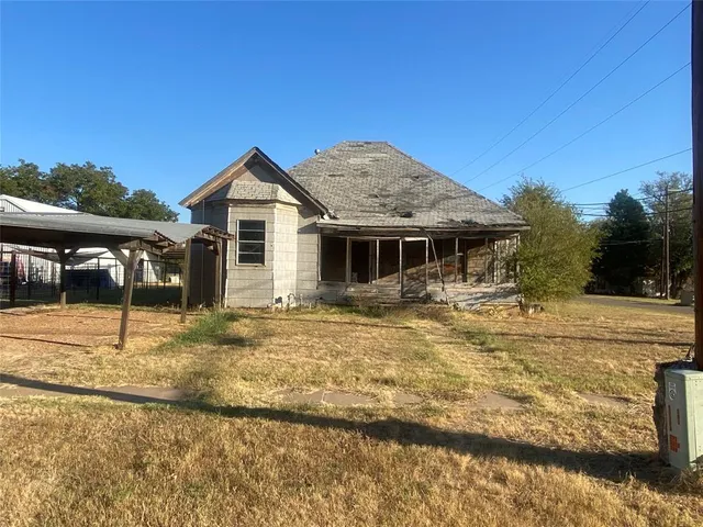 a house with trees in the background