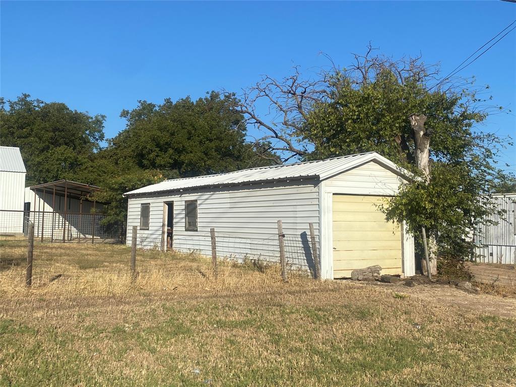 800 South 1st Street Haskell, TX 79521 - Photo 2 of 2 a front view of a house with a yard