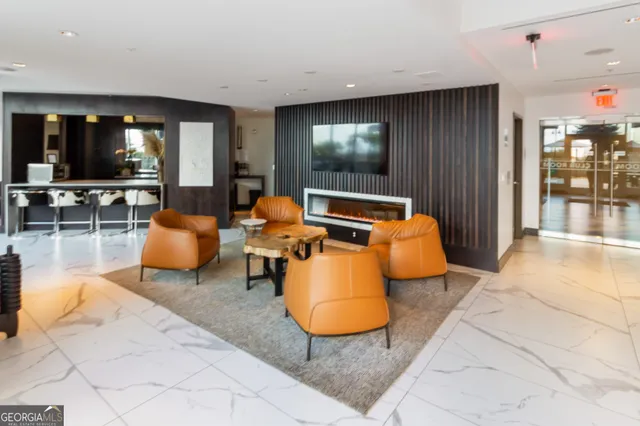 a outdoor living space with furniture and a flat screen tv