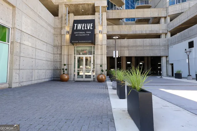 a view of a building with potted plants