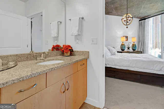 a bathroom with a sink double vanity and a mirror