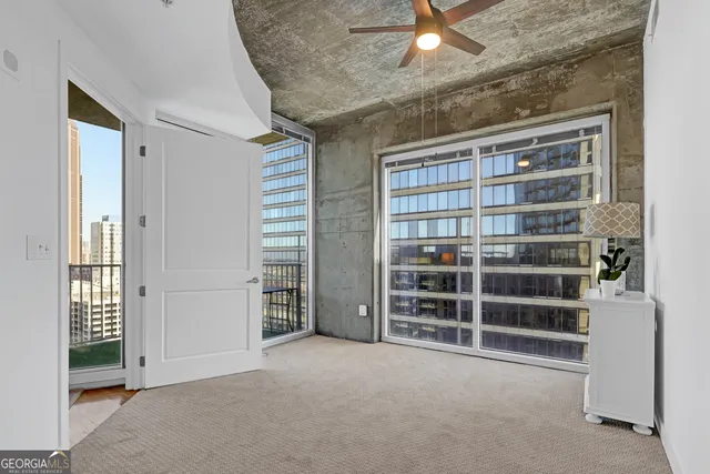 a view of an empty room with a window
