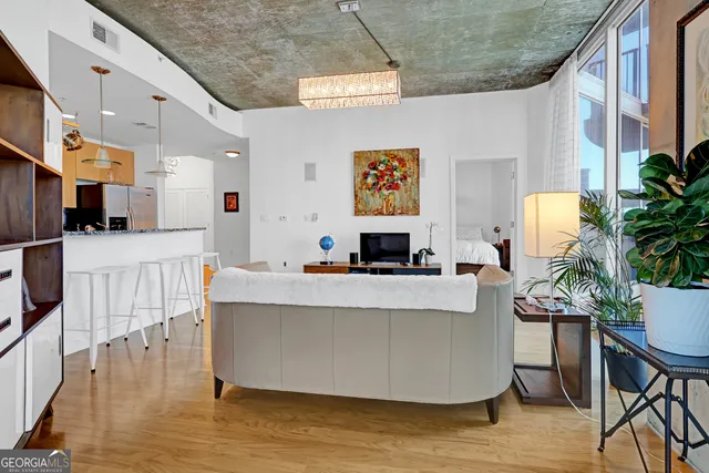 a living room with furniture and a flat screen tv