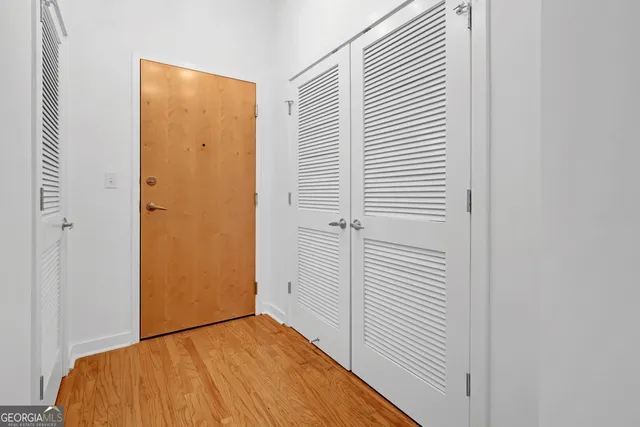 a view of a room that has a bed in it