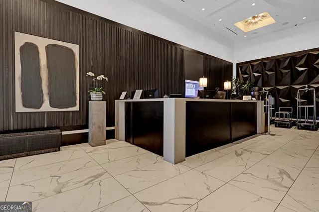 a kitchen with stainless steel appliances kitchen island granite countertop a refrigerator and a wooden cabinets