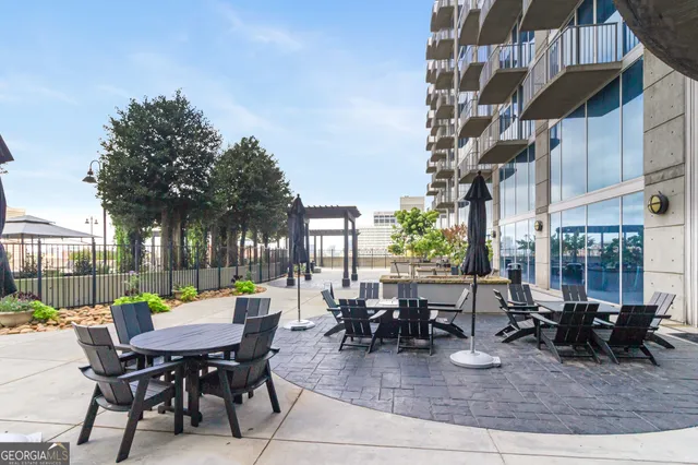 a view of a dinning table and chairs in the patio