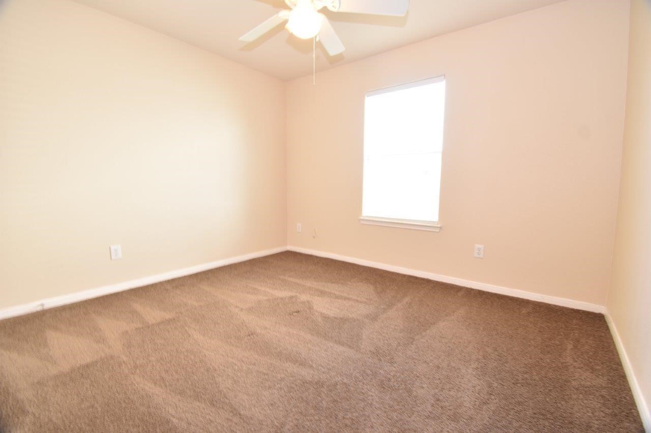 1126 Desert Oasis Lane Rosenberg, TX 77471 - Photo 13 of 16 an empty room with a window