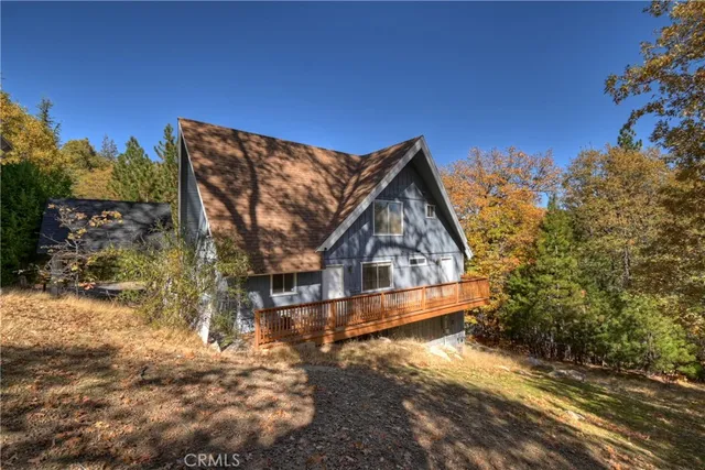 a view of house with a yard