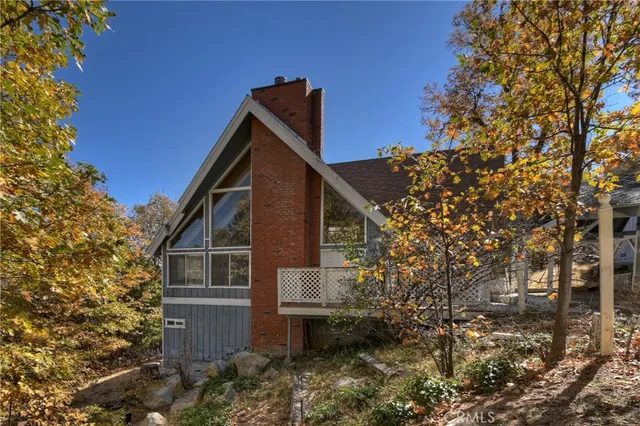 a view of a house with a tree