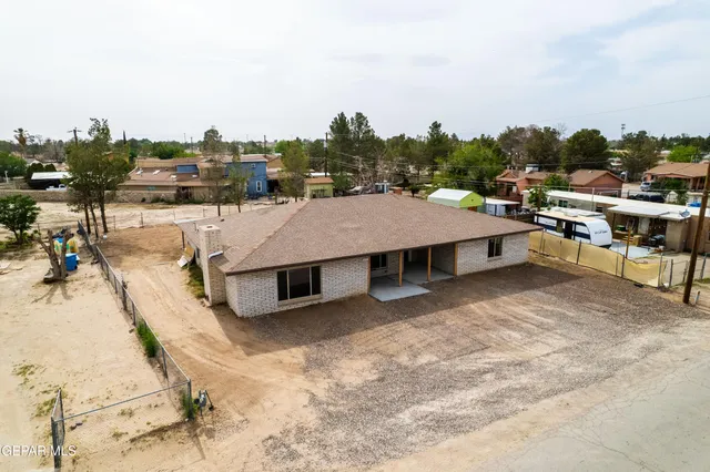 a terrace with outdoor seating and trees