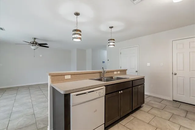 a kitchen with a sink and a stove