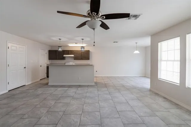 a view of a kitchen with a sink cabinets and window