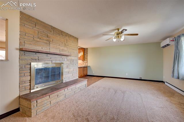 7845 Wilson Road Fountain, CO 80817 - Photo 11 of 30 Living room with fireplace