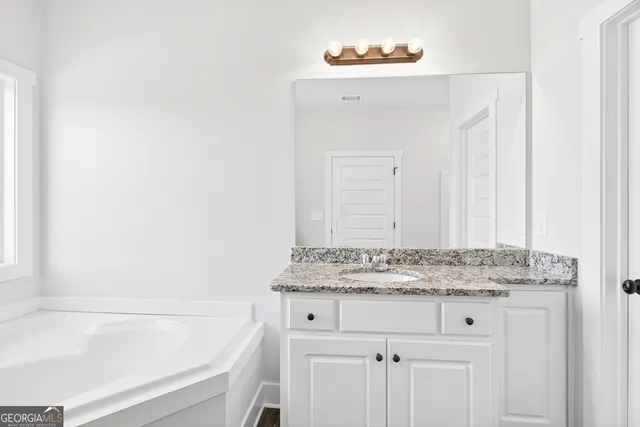 a bathroom with a sink and a bathtub