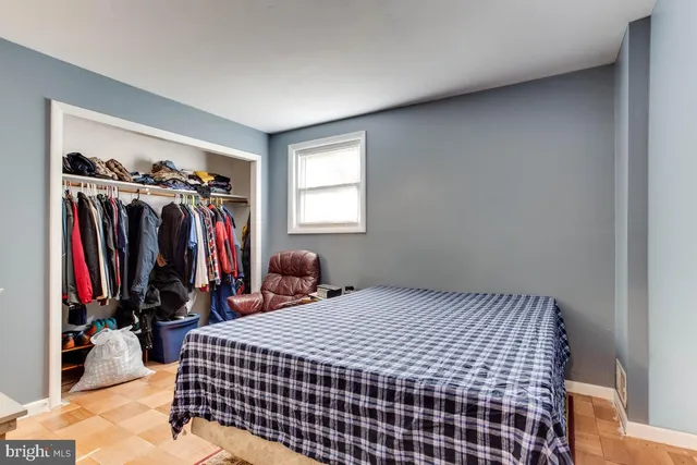 a bed room with a bed and a window