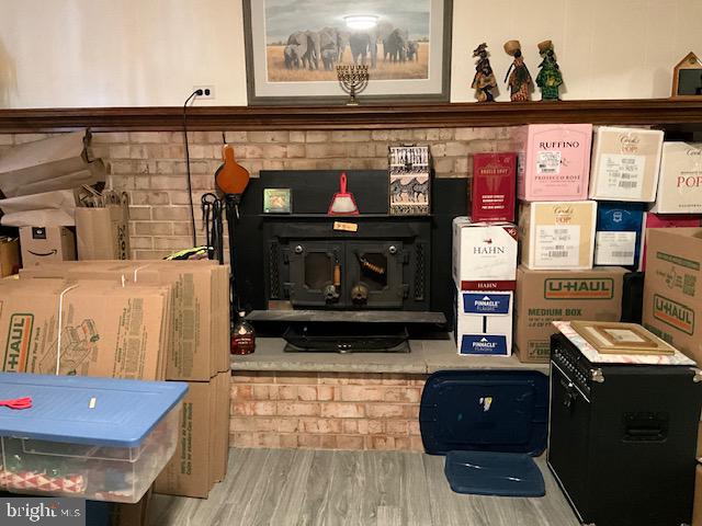 16140 Kenny Road Laurel, MD 20707 - Photo 15 of 26 LL fireplace with brick hearth