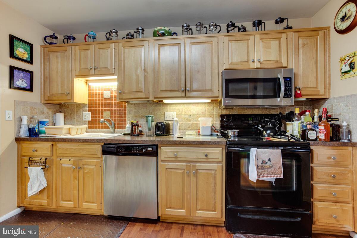 Gas hookup behind electric stove