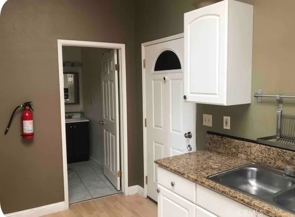 a kitchen with a sink and a refrigerator