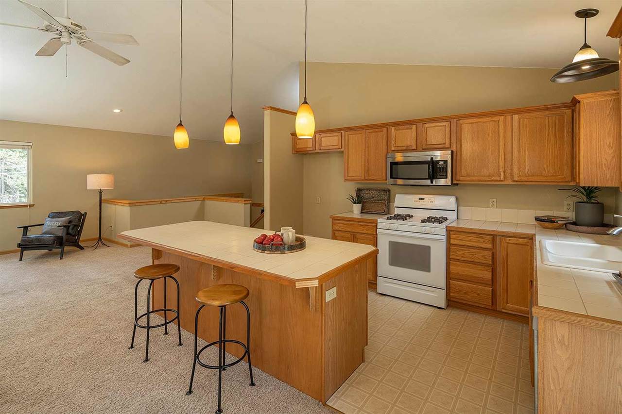 10475 Jeffrey Way Truckee, CA 96161 - Photo 8 of 21 a kitchen with a sink a stove and chairs
