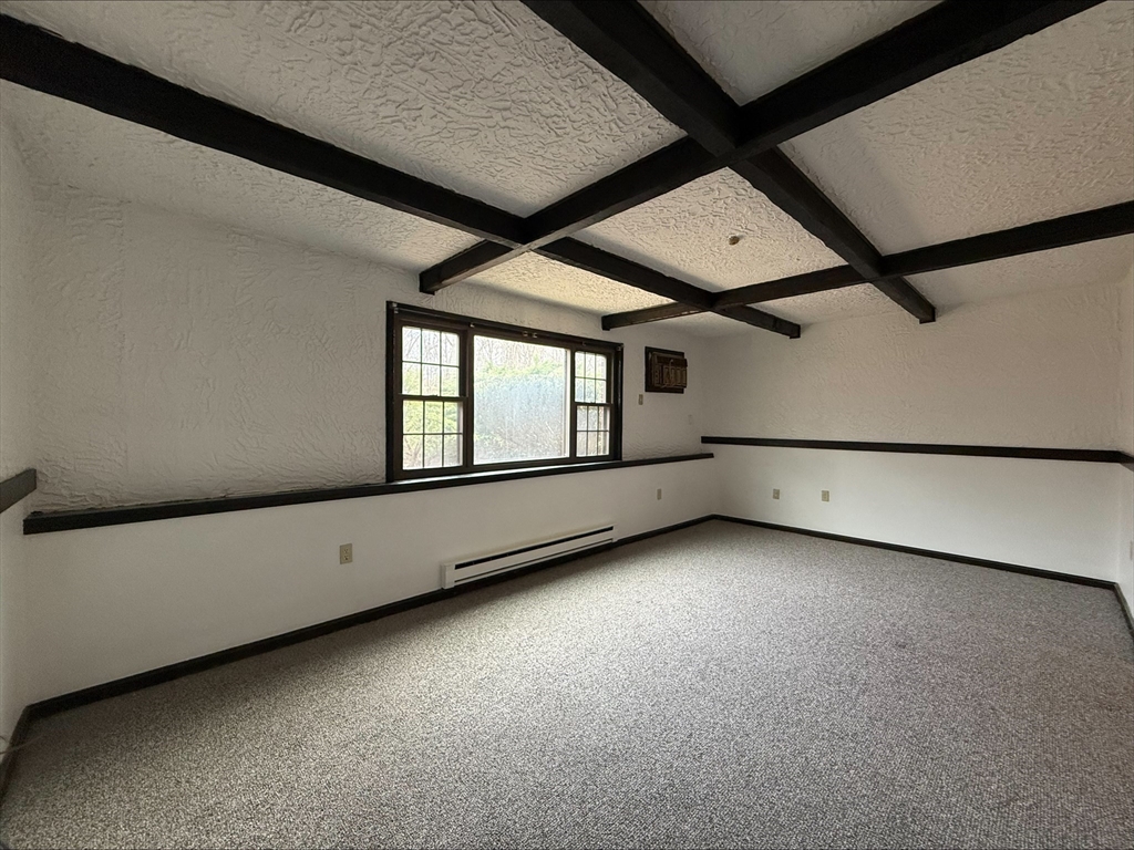 50 Spencer Road, Unit 14L Boxborough, MA 01719 - Photo 3 of 10 a view of an empty room with a window