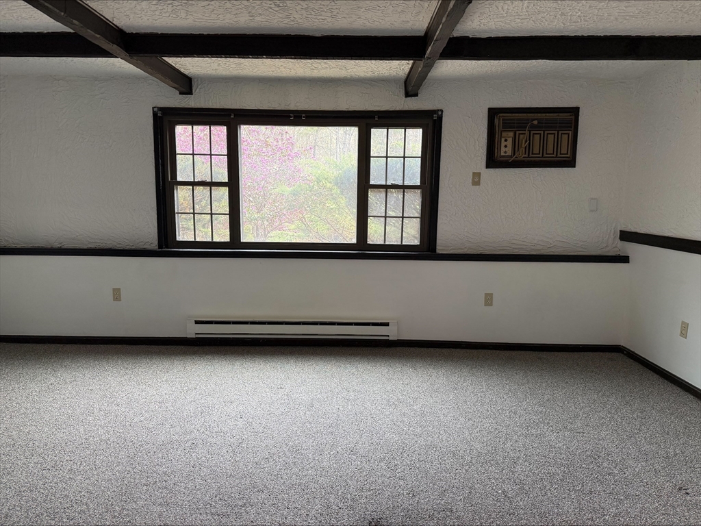 50 Spencer Road, Unit 14L Boxborough, MA 01719 - Photo 6 of 10 a living room with furniture and window
