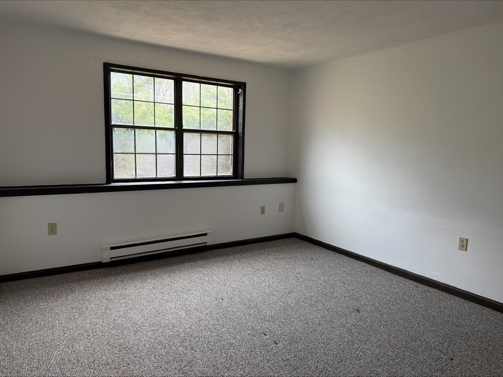 50 Spencer Road, Unit 14L Boxborough, MA 01719 - Photo 7 of 10 an empty room with a window