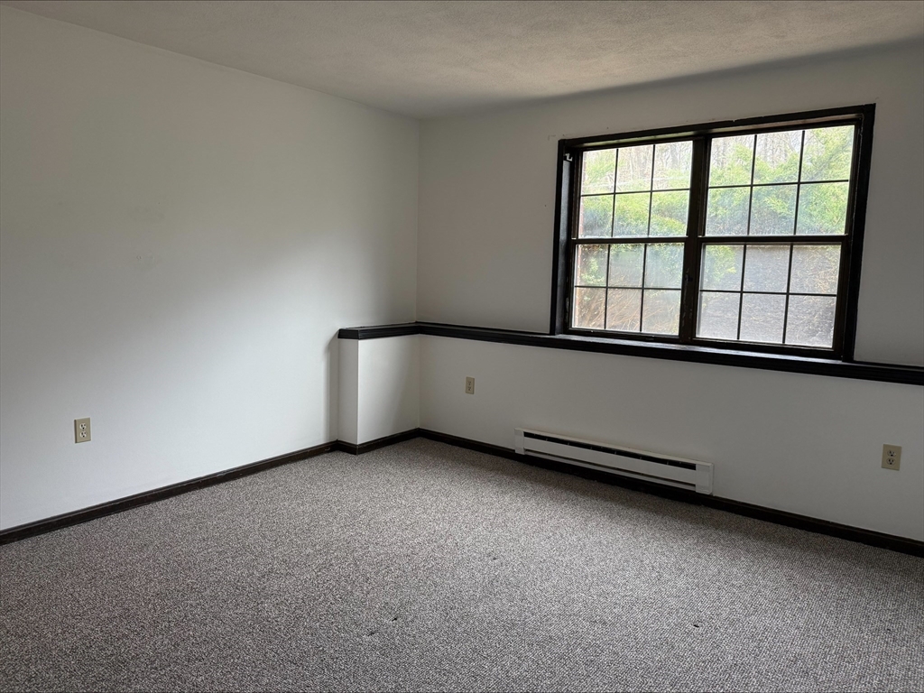 50 Spencer Road, Unit 14L Boxborough, MA 01719 - Photo 8 of 10 an empty room with a window