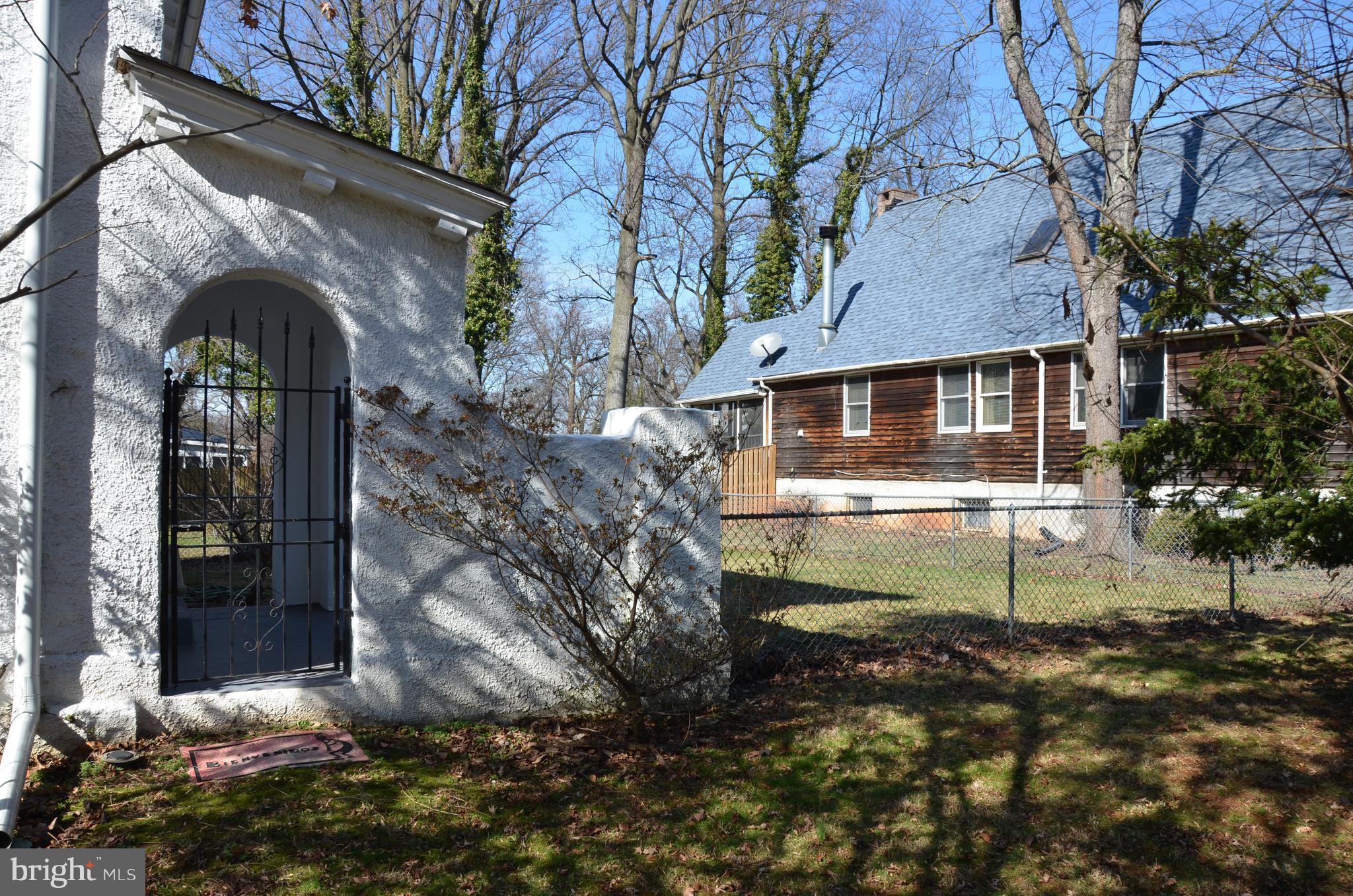 2810 Whitney Avenue Baltimore, MD 21215 - Photo 2 of 29 Gate way to side ent. to kit. & fenced yd