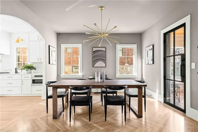 a kitchen with stainless steel appliances kitchen island wooden cabinets stove and window