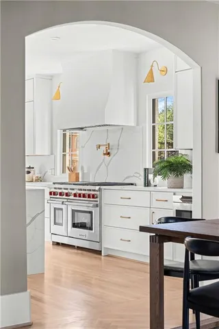 a kitchen with granite countertop a stove and a sink