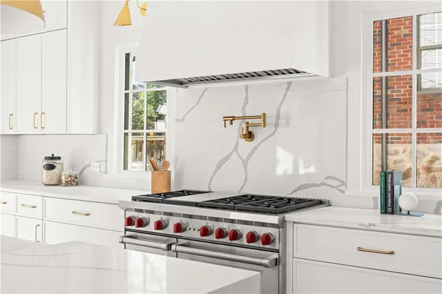 a living room with furniture a window and a fireplace
