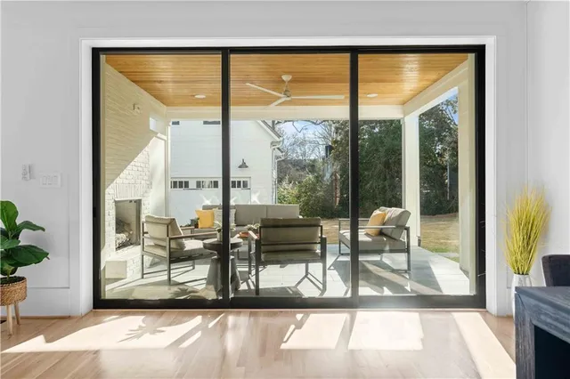 a bathroom with a shower and a glass door