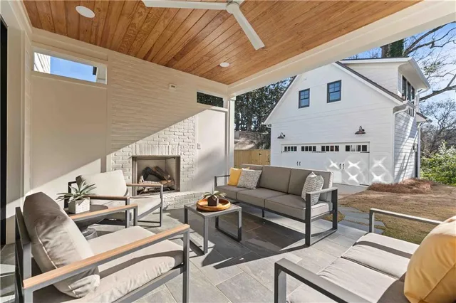a bathroom with double vanity sink a toilet a mirror and shower