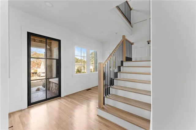 a kitchen with stainless steel appliances a stove a sink and a refrigerator