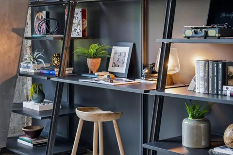 a living room with furniture and a lamp