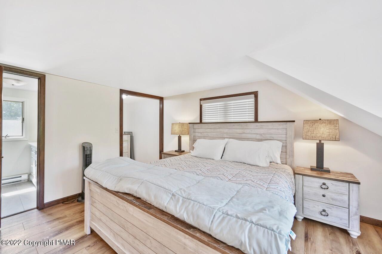 134 Moseywood Road Lake Harmony, PA 18624 - Photo 23 of 70 a bedroom with a bed and a night stand