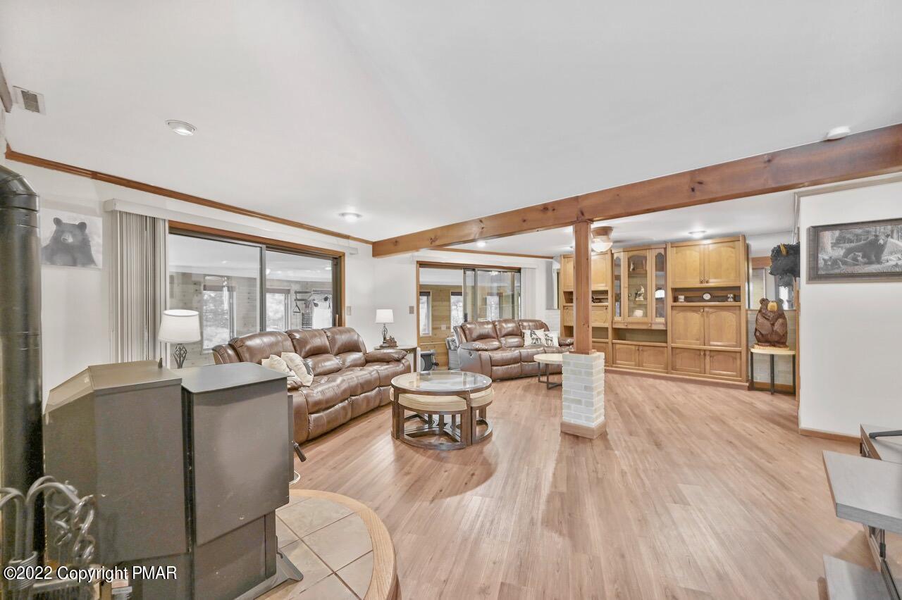 134 Moseywood Road Lake Harmony, PA 18624 - Photo 30 of 70 a living room with fireplace furniture and a large window