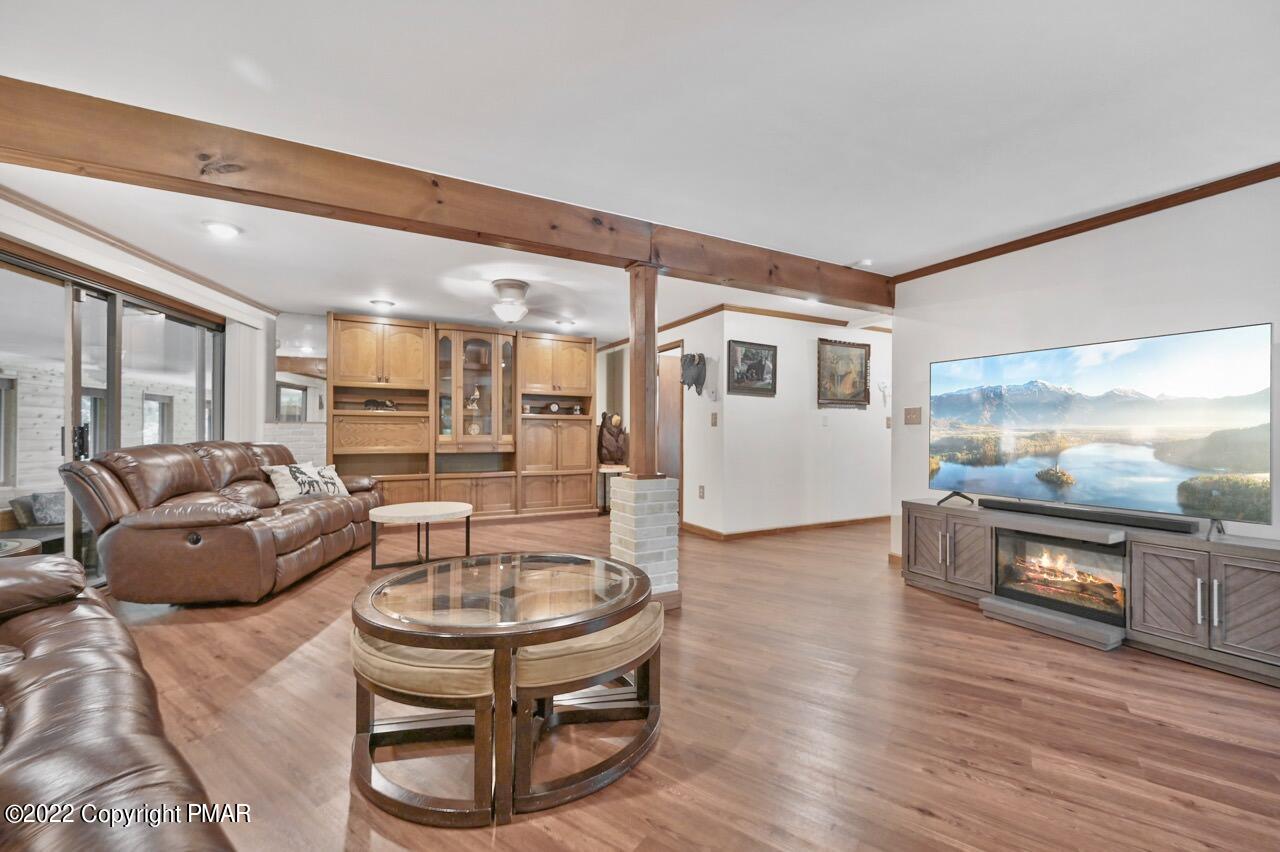 134 Moseywood Road Lake Harmony, PA 18624 - Photo 31 of 70 a living room with furniture and a wooden floor