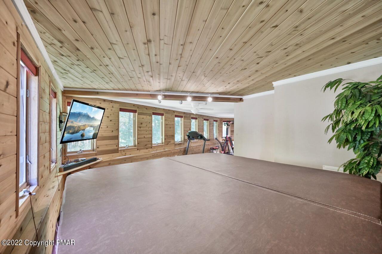 134 Moseywood Road Lake Harmony, PA 18624 - Photo 42 of 70 a view of an empty room with a window and potted plants