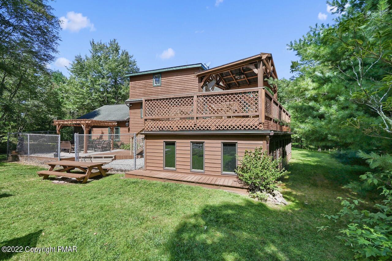 134 Moseywood Road Lake Harmony, PA 18624 - Photo 54 of 70 a front view of a house with a garden and sitting area