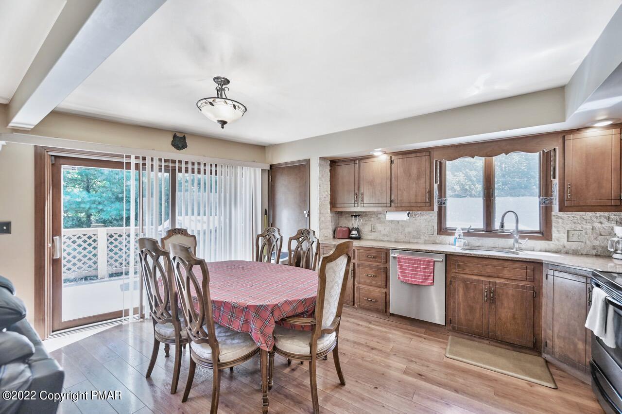 134 Moseywood Road Lake Harmony, PA 18624 - Photo 9 of 70 a dining room with a wooden table and chairs